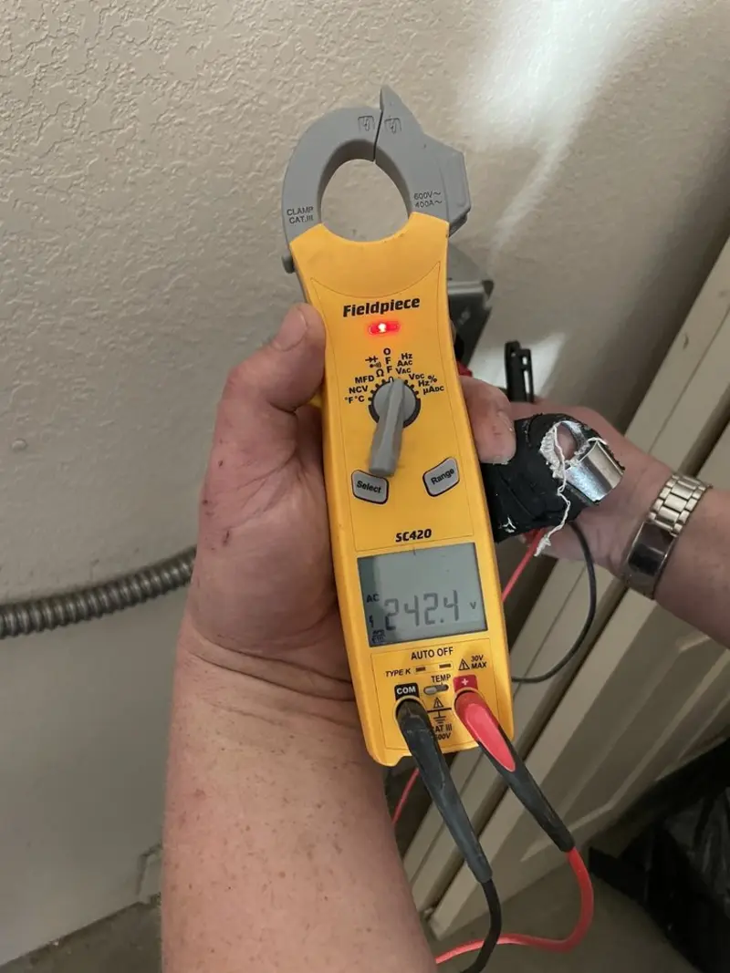 Voltage testing with clamp meter during Electrical Installation Services in Woodbury